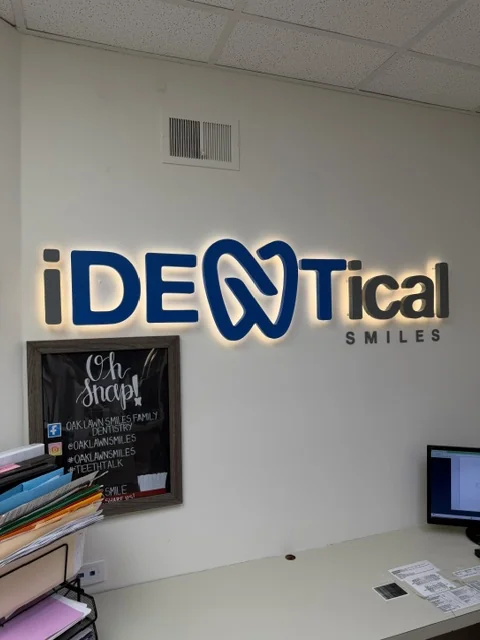 iDENtical Smiles — Lobby Sign